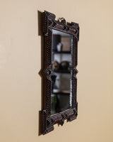 Dark Tramp Art Mirror with Exaggerated Corners, Late 19th Century