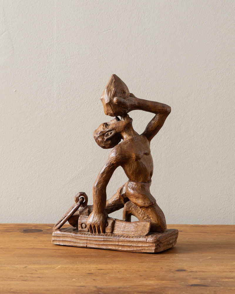 Carved Wooden Man Blowing Shell, Signed