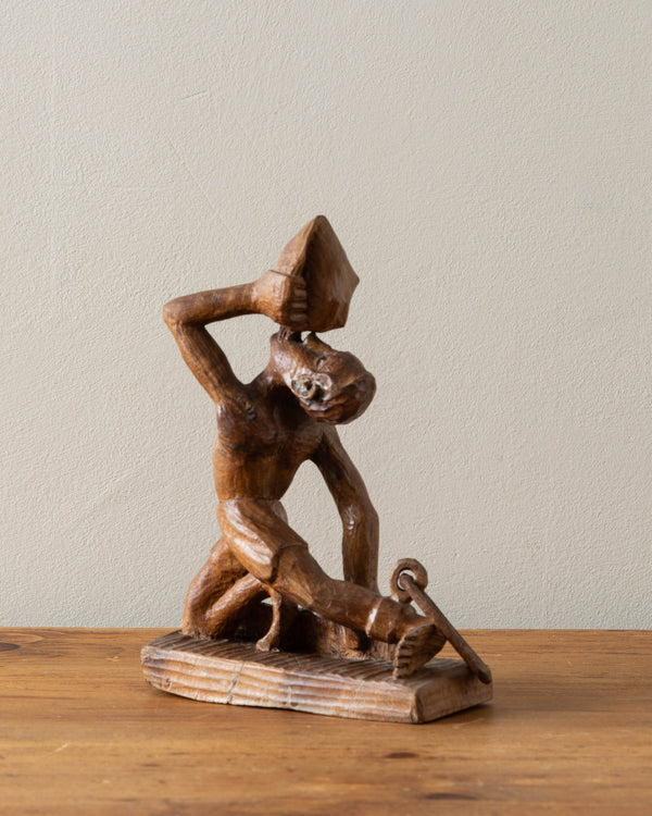 Carved Wooden Man Blowing Shell, Signed