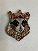 Raccoon on a Plaque
