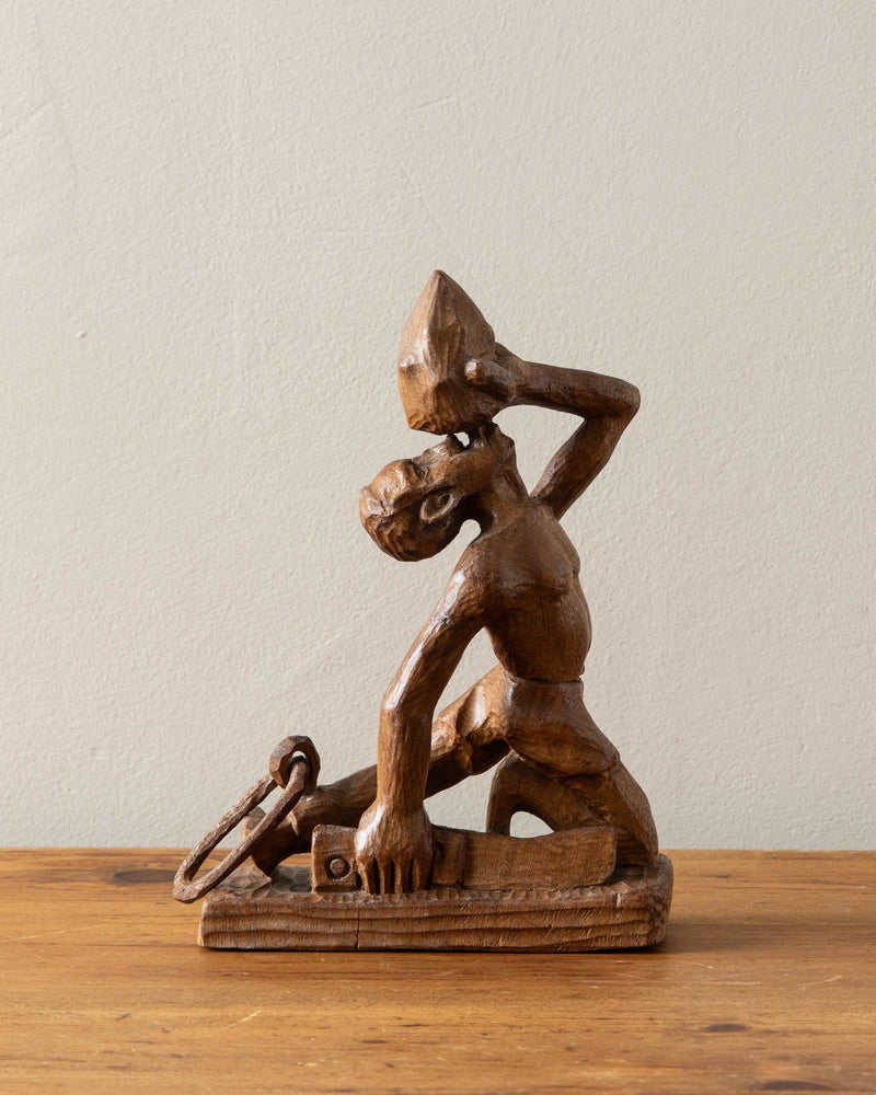 Carved Wooden Man Blowing Shell, Signed - Lone Fox